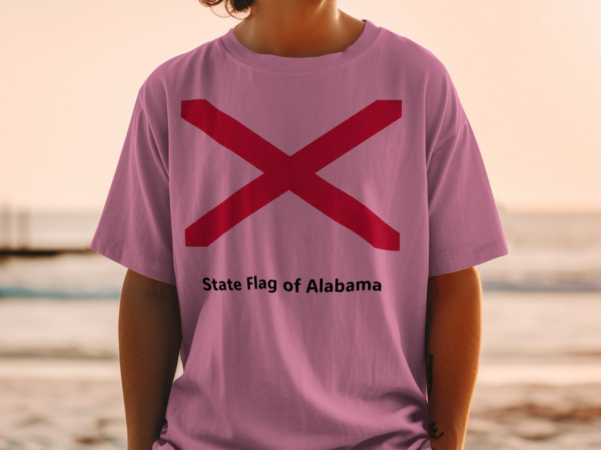 Pink t-shirt with red Alabama state flag and text "State Flag of Alabama".