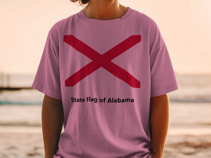 Pink t-shirt with red Alabama state flag and text "State Flag of Alabama".