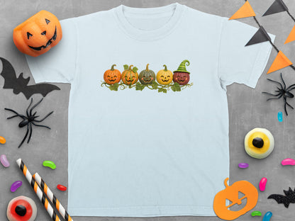 Light blue t-shirt with five smiling pumpkins on a vine.