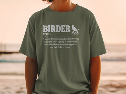Olive green t-shirt with white text defining "BIRDER" and a small bird graphic.
