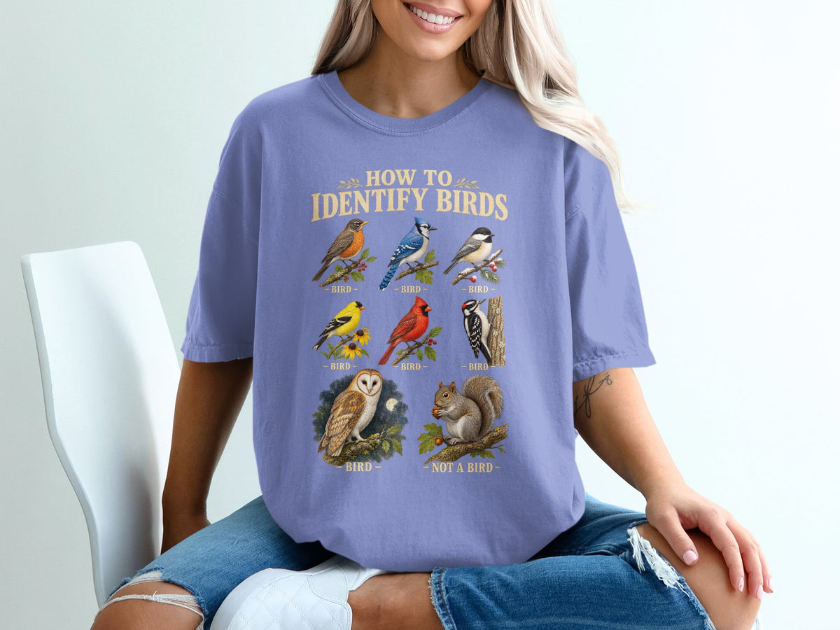 T-shirt with "How to Identify Birds" text and illustrations of various birds and a squirrel.