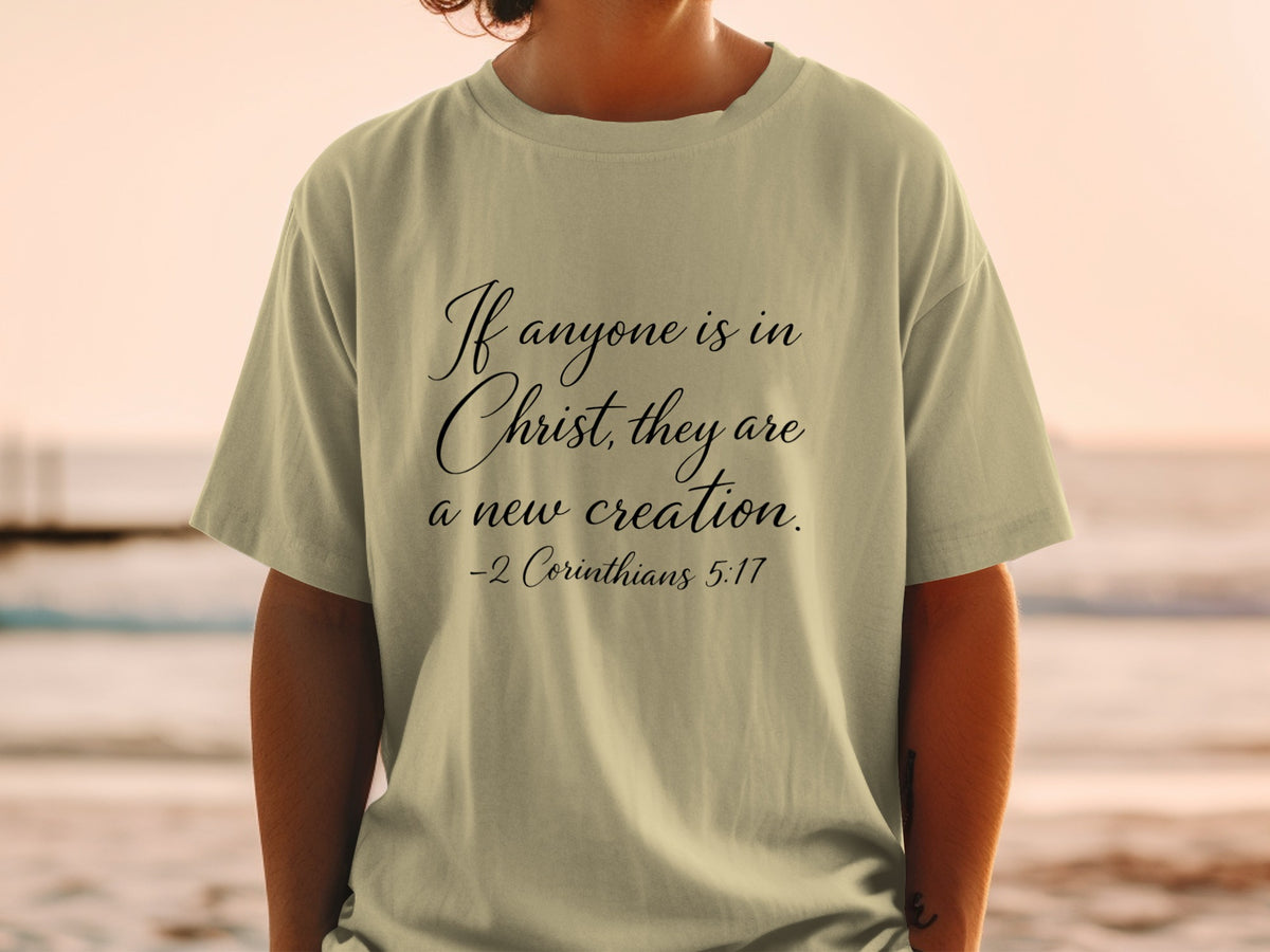 T-shirt with "If anyone is in Christ, they are a new creation. -2 Corinthians 5:17" text
