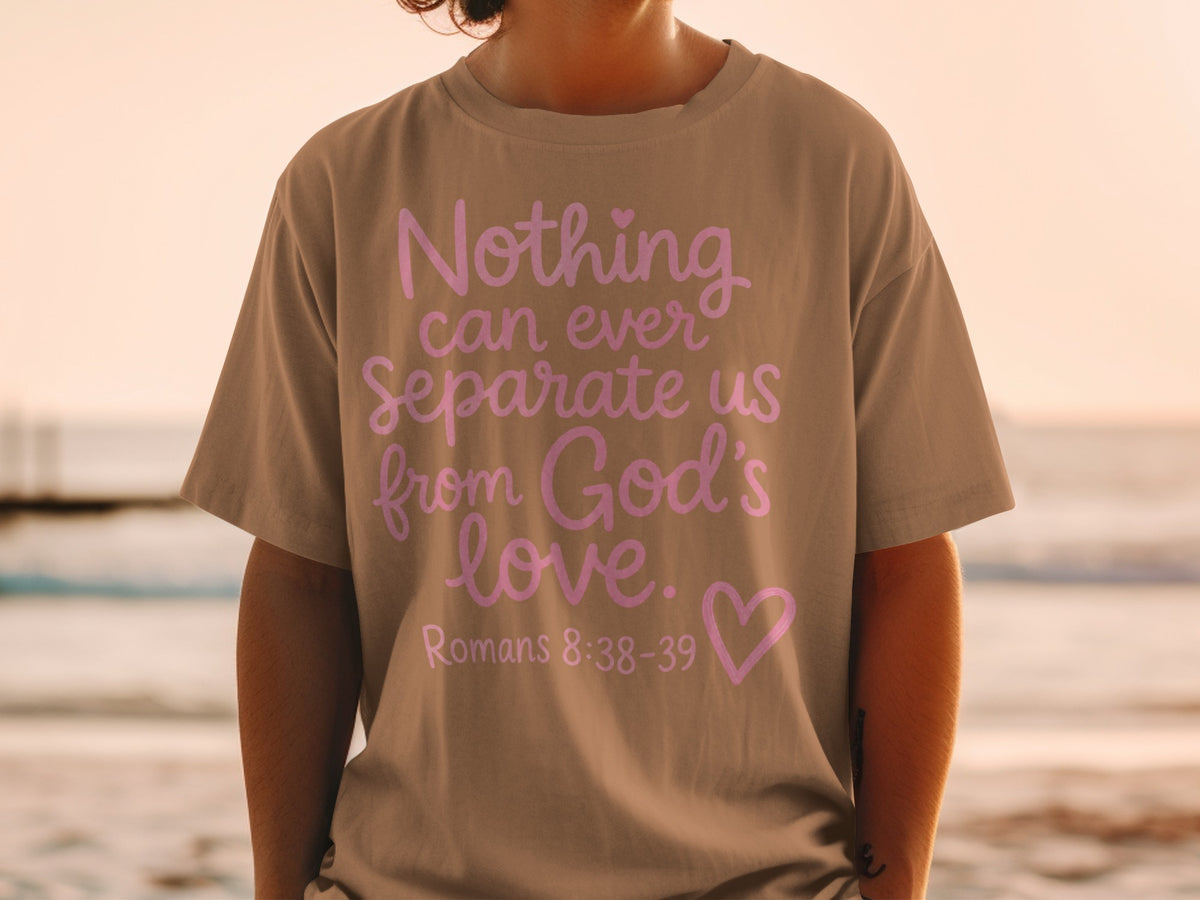 T-shirt with "Nothing can ever separate us from God's love. Romans 8:38-39" in pink.