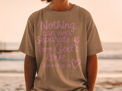 T-shirt with "Nothing can ever separate us from God's love. Romans 8:38-39" in pink.