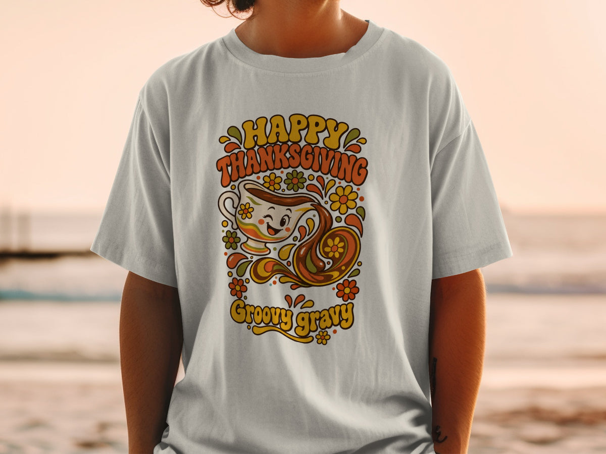 T-shirt with "Happy Thanksgiving Groovy Gravy" text and a retro gravy boat illustration.