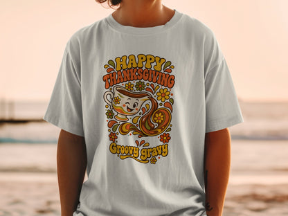 T-shirt with "Happy Thanksgiving Groovy Gravy" text and a retro gravy boat illustration.