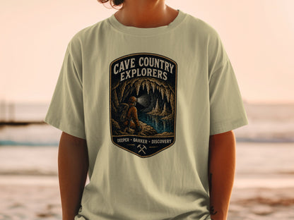Cave Country Explorers design with caver and lake, "Deeper Darker Discovery" text.