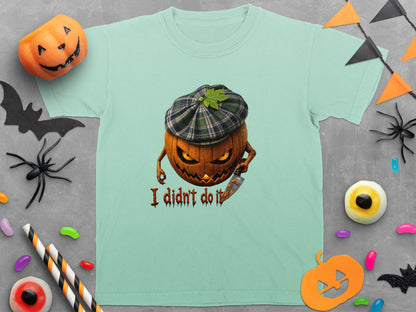Mint t-shirt with a Halloween graphic of a pumpkin wearing a hat and holding a knife, with text.
