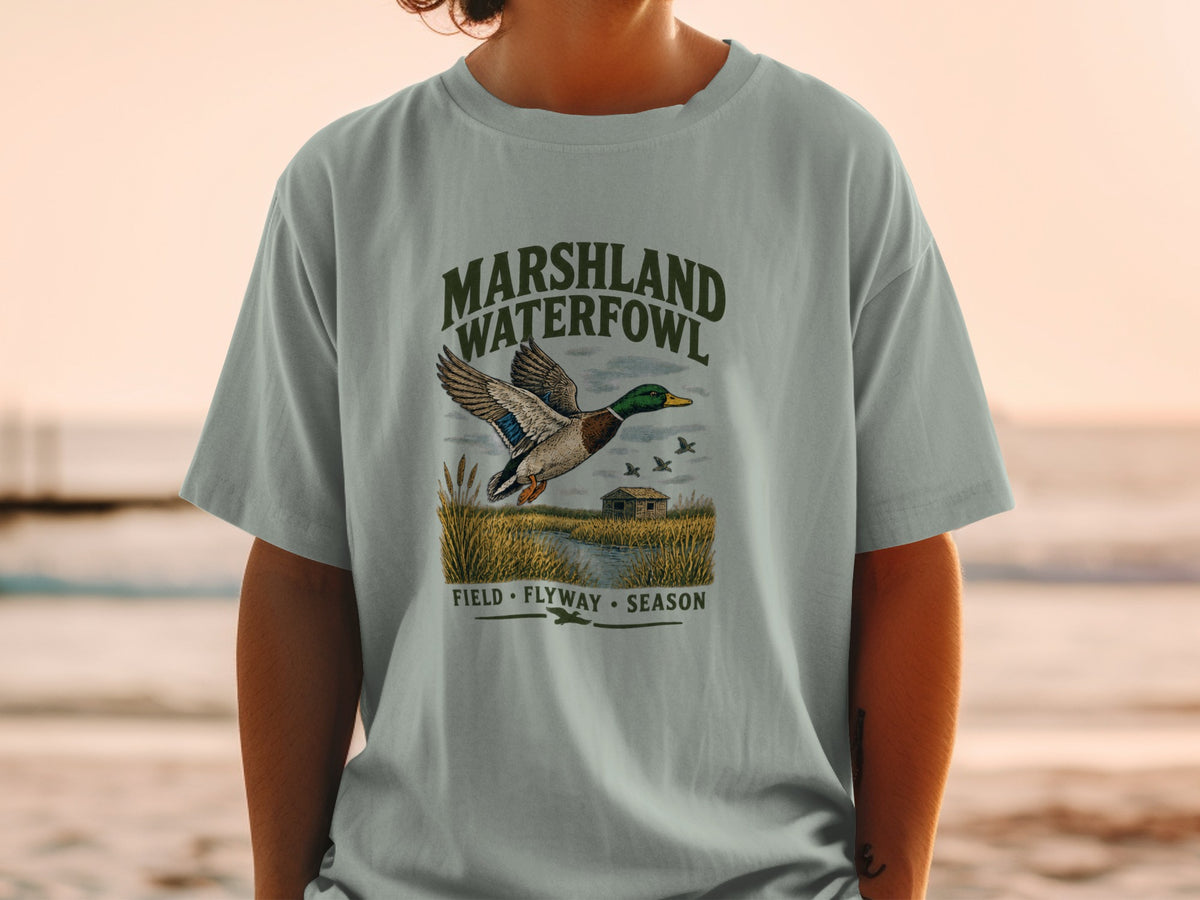 T-shirt with "Marshland Waterfowl" text and a flying duck graphic.