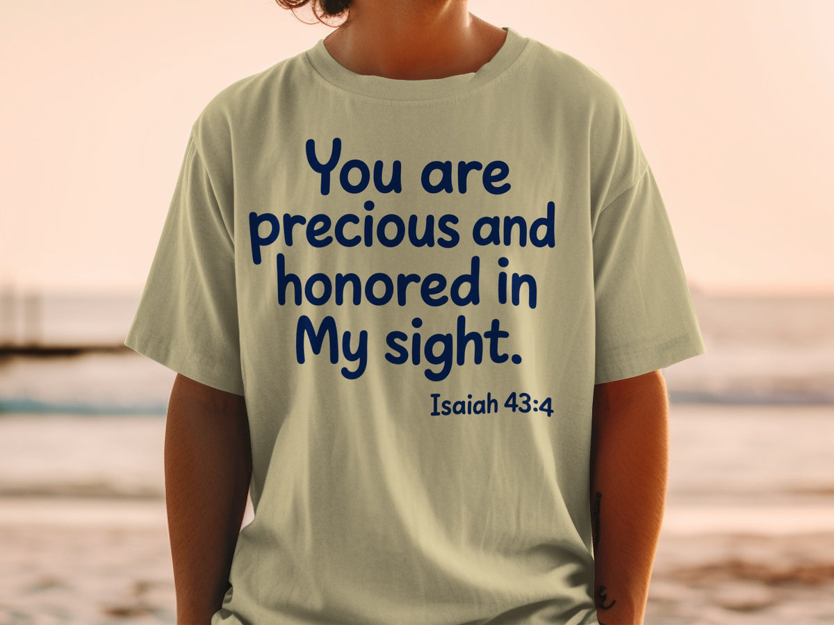 Beige t-shirt with navy text reading "You are precious and honored in My sight. Isaiah 43:4".