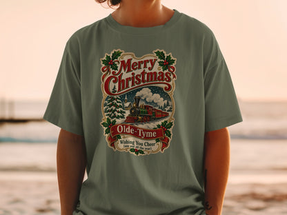Green t-shirt with vintage Christmas train design reading "Merry Christmas Olde-Tyme Wishing You Cheer".
