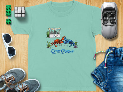 T-shirt graphic of crabs in a claw wrestling match with "Ocean Olympics" text.