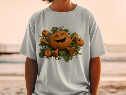 Joyful cartoon pumpkin surrounded by vines and smaller pumpkins on a grey t-shirt.