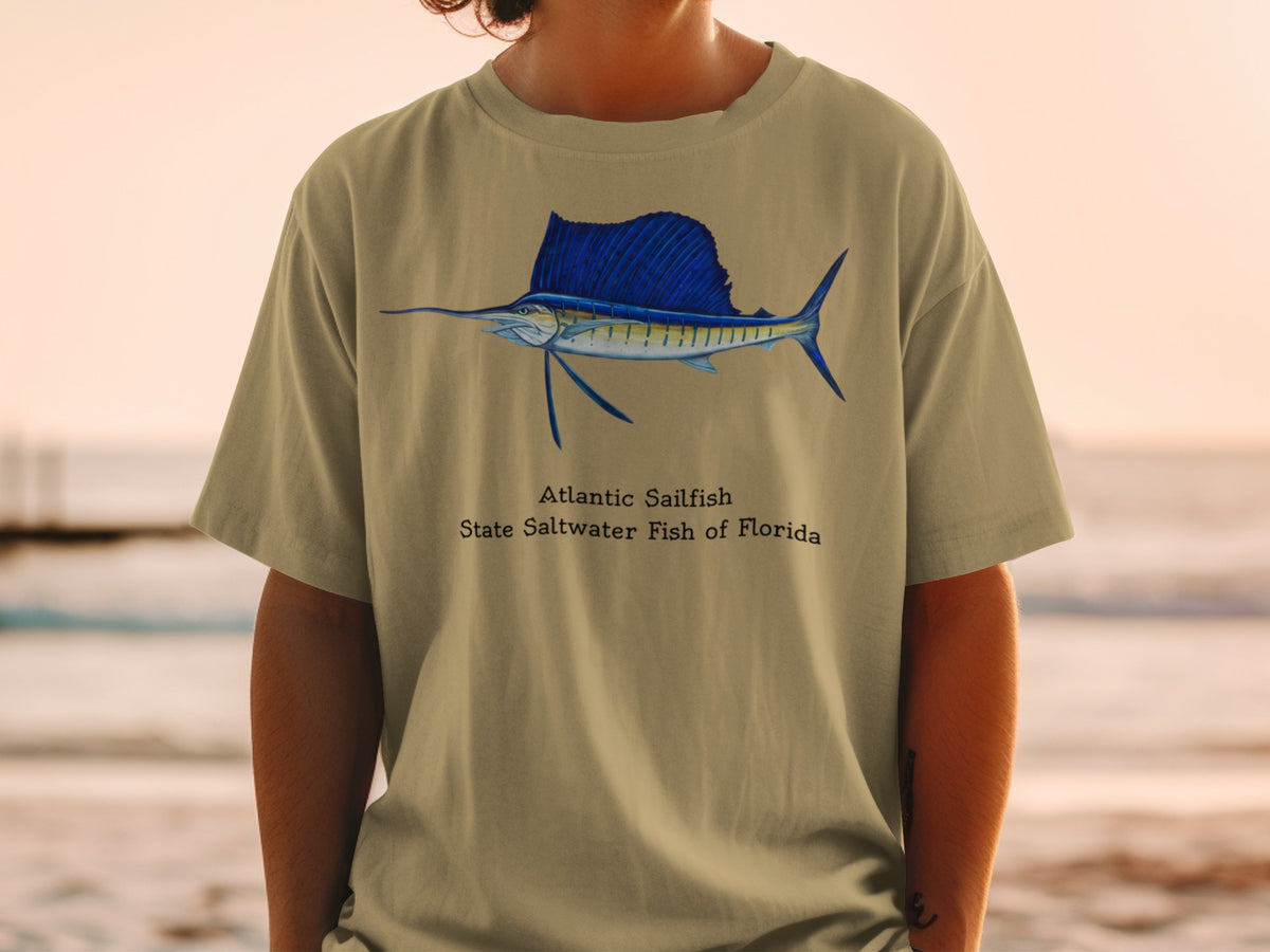 Tan t-shirt featuring a detailed illustration of an Atlantic Sailfish and text.