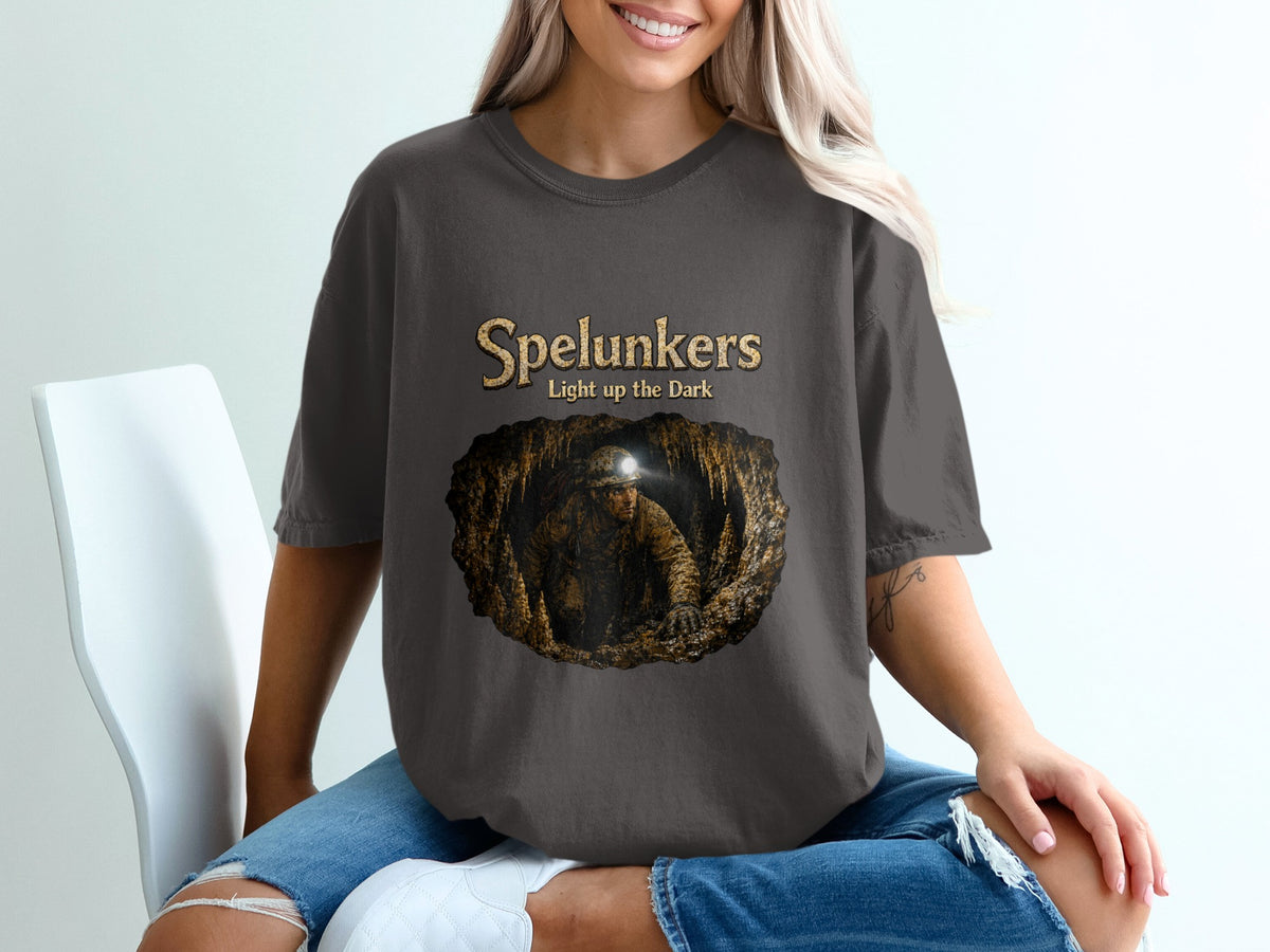 Spelunkers t-shirt with cave explorer graphic and text "Light up the Dark".