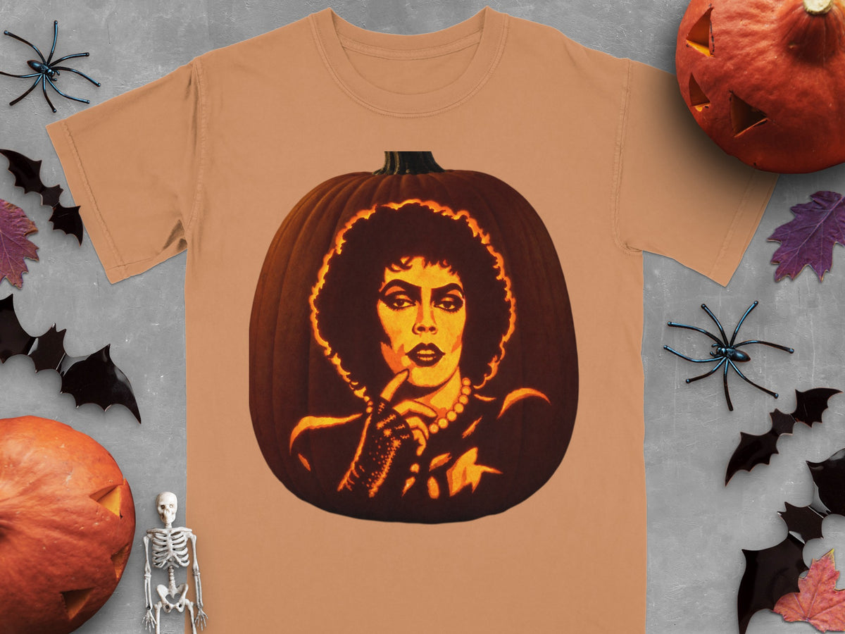 Tan turgid t-shirt featuring a carved pumpkin graphic of Frank-N-Furter, surrounded by Halloween decorations.