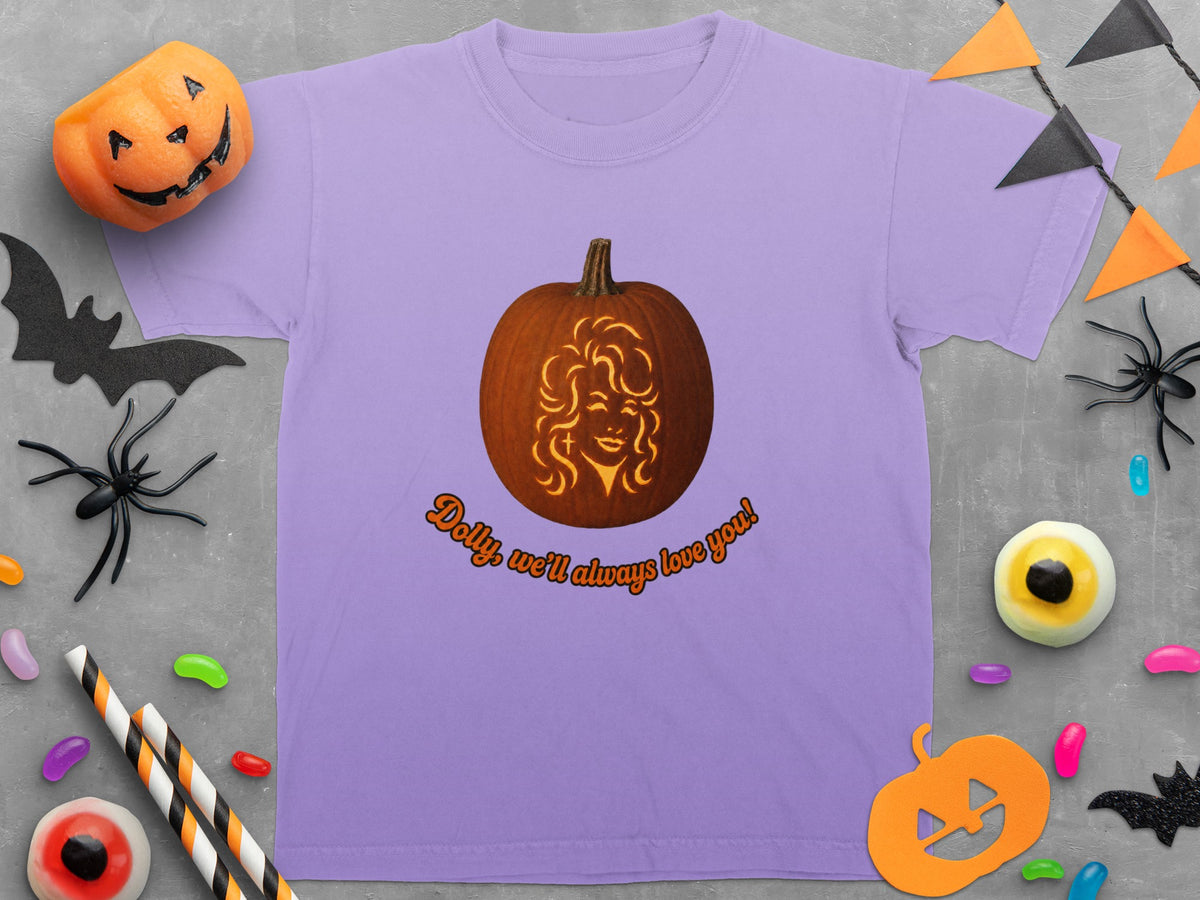 Lavender t-shirt with pumpkin carved Dolly Parton face and text "Dolly, we'll always love you!".