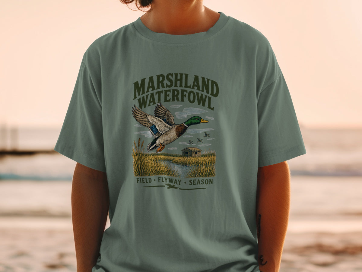 Green t-shirt with "MARSHLAND WATERFOWL" and flying duck graphic.
