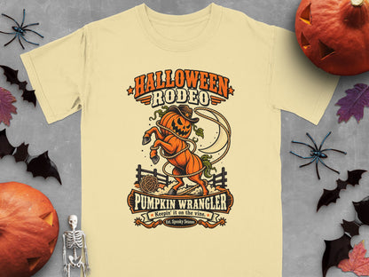 Halloween Rodeo Pumpkin Wrangler t-shirt with lasso and fence design.