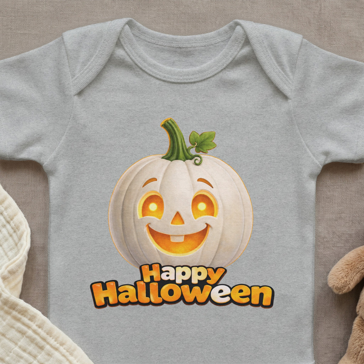 Grey baby onesie with a smiling white pumpkin and "Happy Halloween" text.