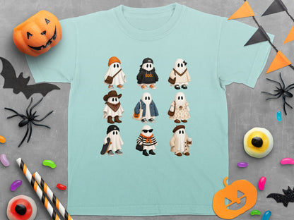 Light blue t-shirt with nine different cartoon ghosts dressed in various Halloween costumes and outfits.
