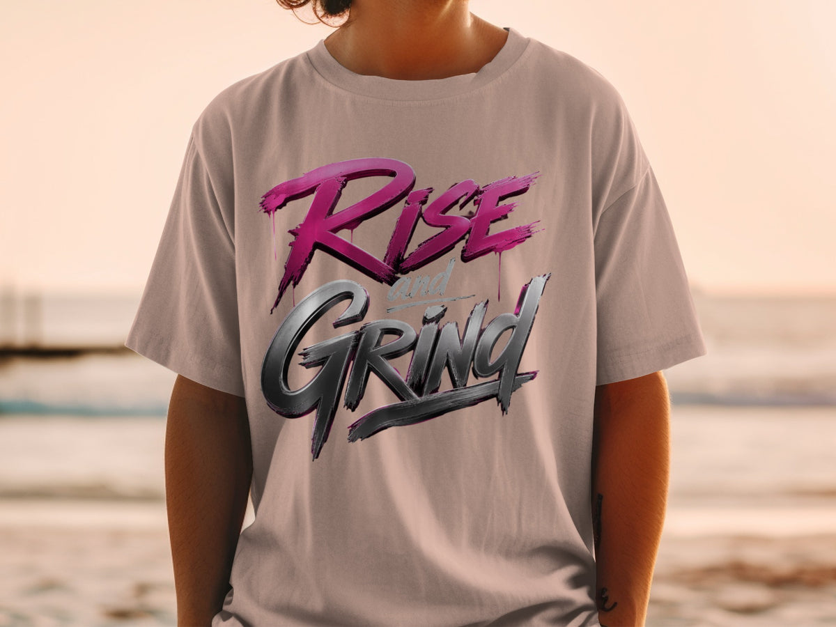T-shirt with "Rise and Grind" text in pink and metallic gray lettering.