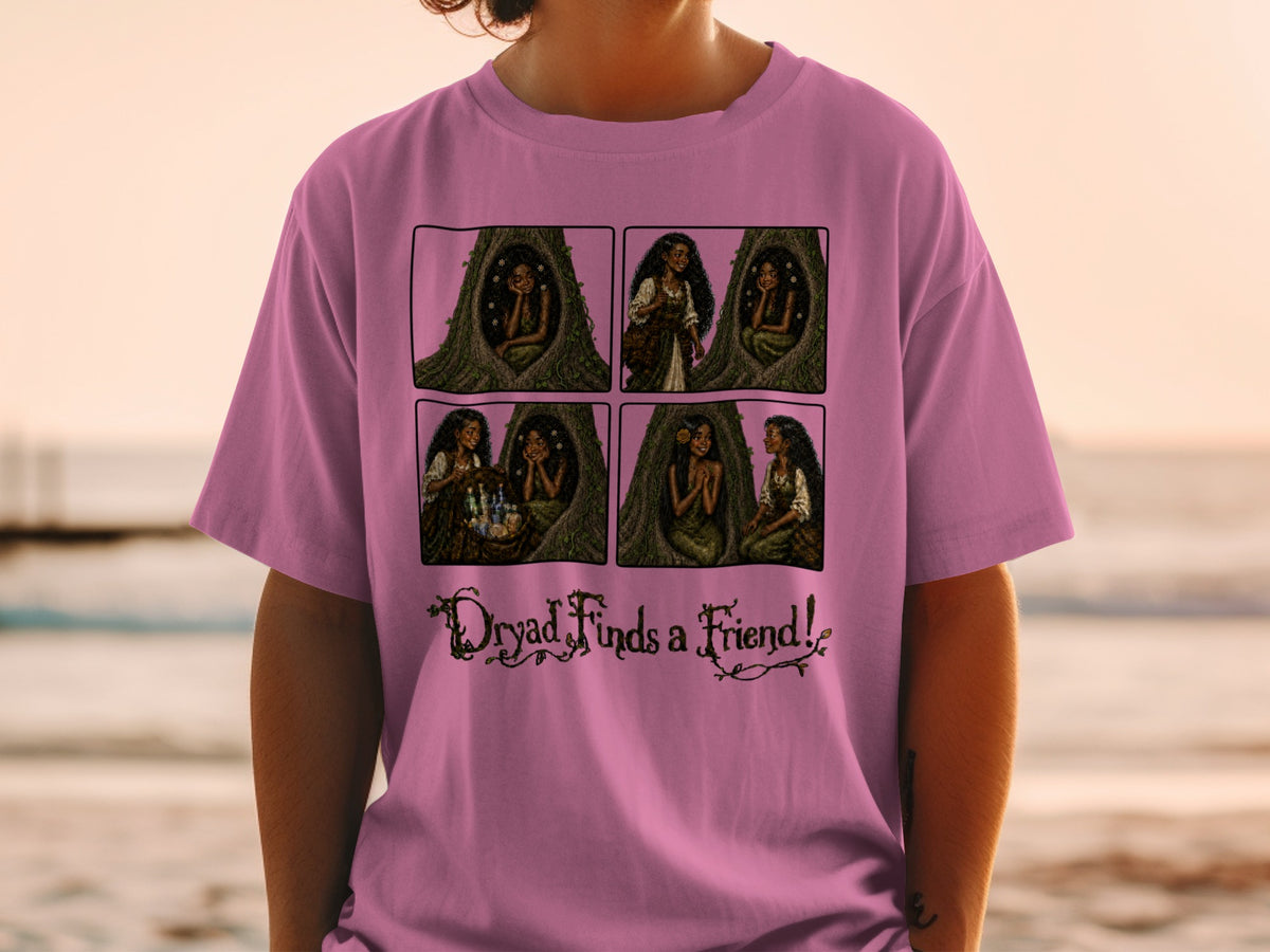 Comic strip on pink t-shirt shows dryad in tree hollow and text "Dryad Finds a Friend!".
