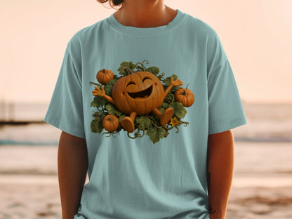 T-shirt with a happy cartoon pumpkin and smaller pumpkins surrounded by green vines.
