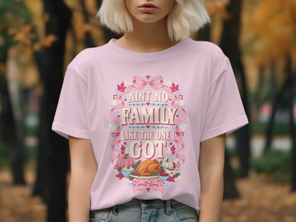 Pink t-shirt with "Ain't No Family Like the One I Got" text and Thanksgiving dinner graphic.