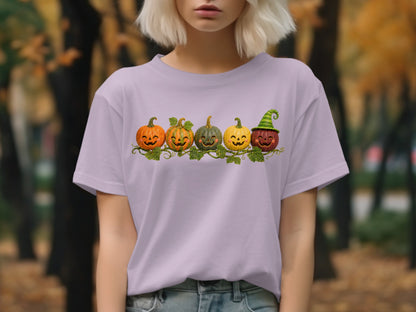 Purple t-shirt with a row of five jack-o'-lanterns and leafy vines.