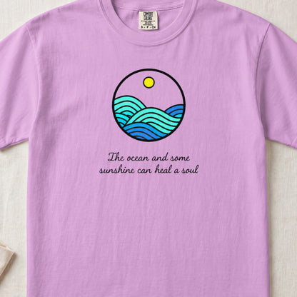 Light purple t-shirt featuring a circular ocean graphic and the text The ocean and some sunshine can heal a soul.