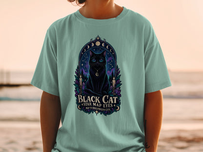 Black cat graphic t-shirt with "Black Cat Star Map Eyes" text.
