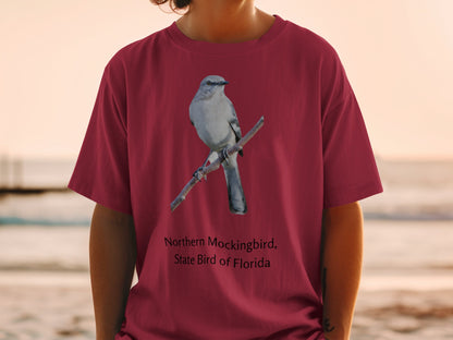 Northern Mockingbird, State Bird of Florida graphic on maroon t-shirt.