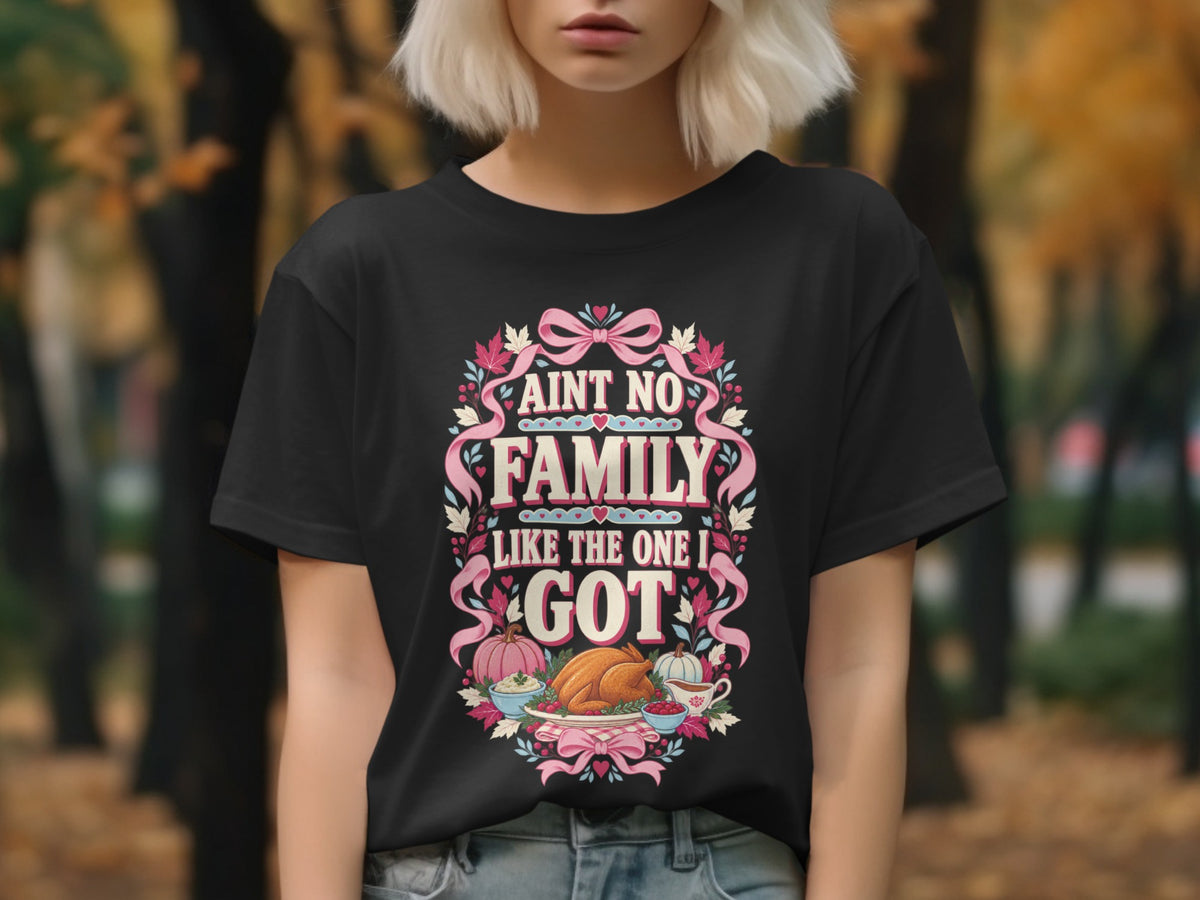 Black t-shirt with "Ain't no family like the one I got" and Thanksgiving food illustration.