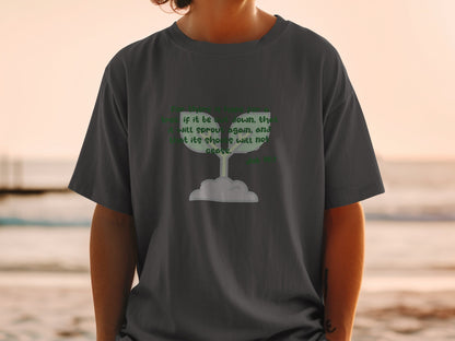 Dark t-shirt with green text and a sprouting seedling graphic: "For there is hope for a tree if it be cut down, that it will sprout again, and that its shoots will not cease. Job 14:7"